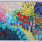 Spring Feast is a colourful abstract painting featuring a garden path with red tulips, blue-green bush-like shapes, yellow steps, and a vibrant background of pink, yellow, and blue dots and squares.